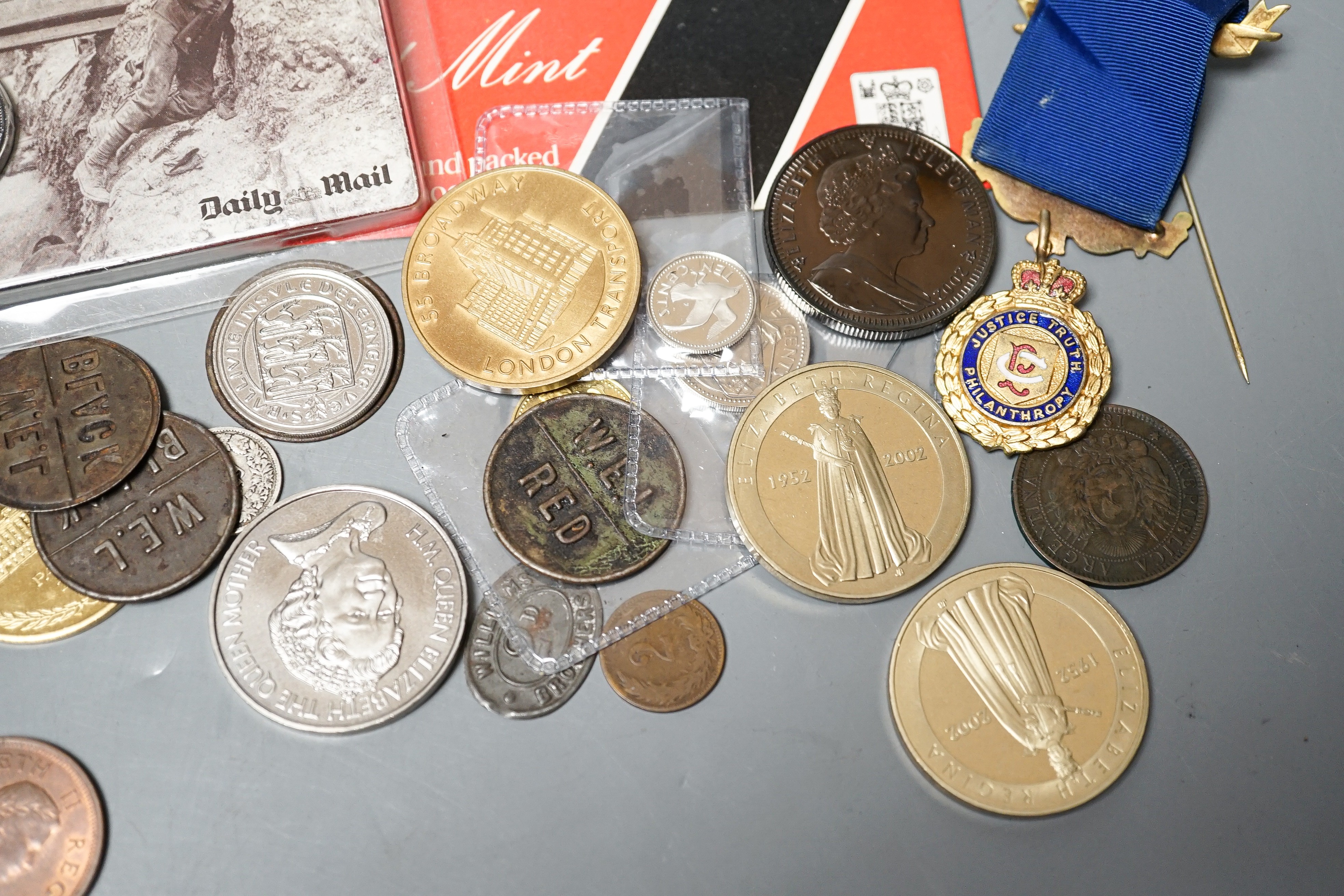A collection of military badges and a collection of coins